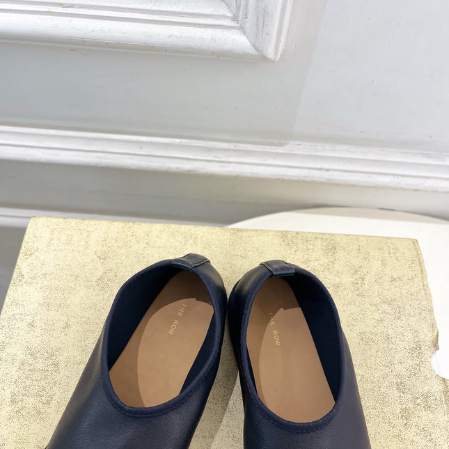 THE ROW 26S SLIP-ON FLATS IN BLACK NAPPA CALFSKIN