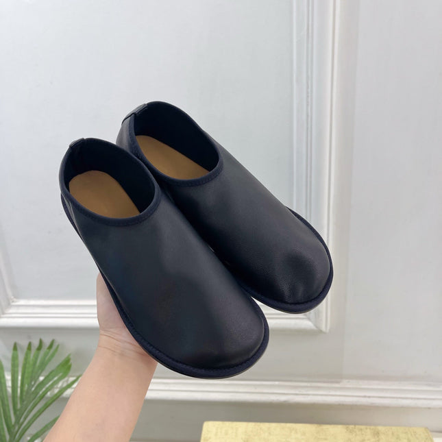 THE ROW 26S SLIP-ON FLATS IN BLACK NAPPA CALFSKIN
