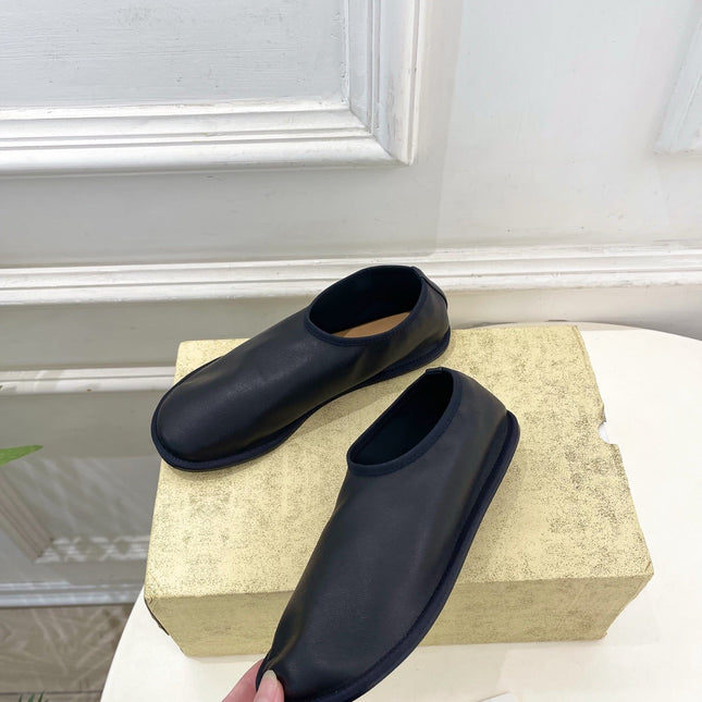 THE ROW 26S SLIP-ON FLATS IN BLACK NAPPA CALFSKIN