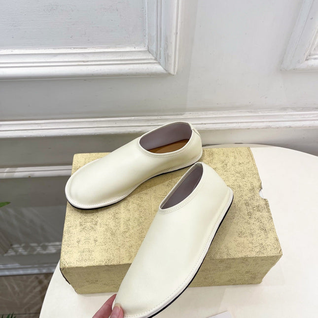 THE ROW 26S SLIP-ON FLATS IN WHITE NAPPA CALFSKIN