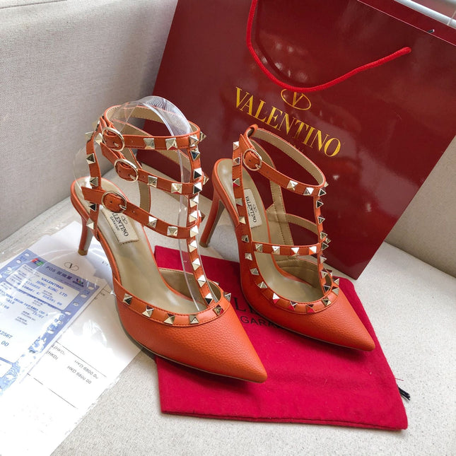 ROCKSTUD FIRE ORANGE METALLIC CALFSKIN ANKLE STRAP HIGH SANDAL